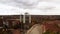 Aerial view of 4G and 5G telecommunications tower cellular network antenna on the roof of a building