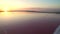 Aerial view 4k. Fabulous sunset at the dead salt sea. Pink salt brine.