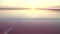 Aerial view 4k. Fabulous sunset at the dead salt sea. Pink salt brine.