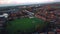 Aerial view 4k small town in Rutland, UK. Rutland water lake sunset, moon out and stormy clouds