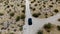 Aerial view of 4x4 car driving off road in the desert. Joshua Tree