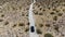 Aerial view of 4x4 car driving off road in the desert. Joshua Tree