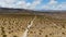 Aerial view of 4x4 car driving off road in the desert. Joshua Tree