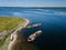 Aerial view of abandoned and derelict rusty old ships near lonaly island in The Arctic Ocean. Russia. White Sea