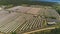 Aerial view of abandoned farm in natural countryside on summer day.