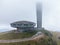 Aerial view of an abandoned soviet monument Buzludzha made in the style of brutalism, Bulgaria