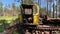 Aerial view abandoned tractor snowcat industrial trash vehicle at summer forest landscape