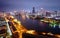 Aerial view above Kaohsiung Harbor in evening, a vibrant seaport in Southern Taiwan, with landmark 85 Sky Tower