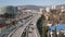 Aerial view from above modern city Sochi with highway road traffic transport architecture and street. Flying drone over