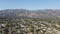 Aerial view above Pasadena neighborhood with mountain on the background. California