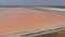 Aerial view above red Salt production pools in Albania, drone shot