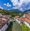 An aerial view above the Selca Sora river towards the Capuchin bridge in the old town of Skofja Loka, Slovenia