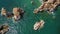 Aerial view from above, waves splashing on reefs on the Portuguese Algarve coast.