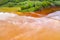 Aerial view of acid colorful mine waste waters