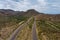 Aerial view adventure traveling desert road of the asphalt highway across the arid desert Arizona mountains