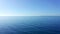 Aerial view of Aegean Sea in Athens, Greece. A person rowing a boat