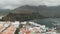 Aerial view of Agaete, Gran Canaria, Canary Islands. Port in a small bay with expensive yachts, white houses and a