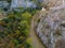 Aerial view of the Aggitis canyon in Greece offers a breathtaking aerial view of the winding river, steep cliffs, and lush