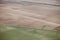 An aerial view of agricultural sprinkler systems operating in farm field.s