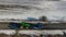 Aerial view of agricultural vehicles on a trawl in winter.