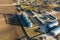 aerial view of agro-industrial complex with silos and grain drying line