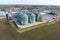 aerial view of agro-industrial complex with silos and grain drying line