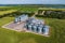 Aerial view on agro silos granary elevator with seeds cleaning line on agro-processing manufacturing plant for processing drying