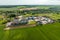 Aerial view on agro silos granary elevator with seeds cleaning line on agro-processing manufacturing plant for processing drying