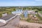 aerial view on agro silos granary elevator with seeds cleaning line on agro-processing manufacturing plant for processing drying