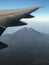 Aerial view of Agung volcano peak in Bali from plane window