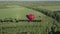 Aerial view air balloon in heart shape on green field, romantic travel