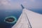 Aerial View from Aircraft Window to the Male Island among the Blue Indian Ocean