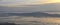 Aerial view from airplane of Antelope Island at sunset, view from Magna, sweeping cloudscape at sunrise with the Great Salt Lake