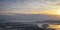 Aerial view from airplane of Antelope Island at sunset, view from Magna, sweeping cloudscape at sunrise with the Great Salt Lake