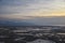 Aerial view from airplane of Antelope Island at sunset, view from Magna, sweeping cloudscape at sunrise with the Great Salt Lake
