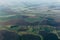 Aerial view from airplane, earth, green fields, roads