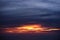 Aerial view from airplane of rain clouds and blue sky in twilight