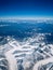 Aerial view from the airplane, snow cover the mountains