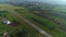 Aerial view of the airplane on take-off approach at the airport runway. morning fog over the city