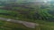 Aerial view of the airplane on take-off approach at the airport runway. morning fog over the city