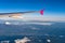 Aerial view of airplane wing with Mount Fuji ( Mt. Fuji ) in background and blue sky