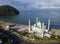 Aerial view of Al-Hakim Mosque. is a Taj Mahal-style mosque on the shores of Padang Beach, Padang City, West Sumatra, Indonesia.