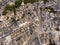 Aerial view of Alberobello, city of Trulli in Itria Valley, Puglia. Traditional Apulian dry stone huts with a conical roof in the