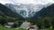 Aerial view of Alpine Valley with rustic farm in front