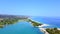 Aerial view of amazing blue lagoon for docking boats with small passage between to sand beaches