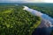 aerial view of the amazonas river, with lush green foliage in the background