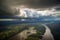 aerial view of the amazonas, with thunderstorm brewing in the distance