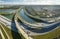 Aerial view of american freeway intersection with fast driving cars and trucks in Miami, Florida. View from above of USA