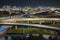 Aerial view of american freeway intersection at night with fast driving cars and trucks in Miami, Florida. View from