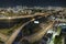 Aerial view of american freeway intersection at night with fast driving cars and trucks in Miami, Florida. View from